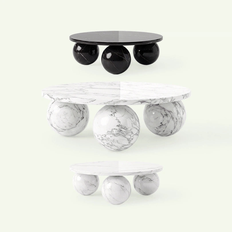 Übersicht der Belnor Couchtisch-Kollektion. Das Bild zeigt das Design mit den markanten Kugelfüßen in drei Varianten: Nero Marquina sowie Calacatta White und Arabescato Marmor.