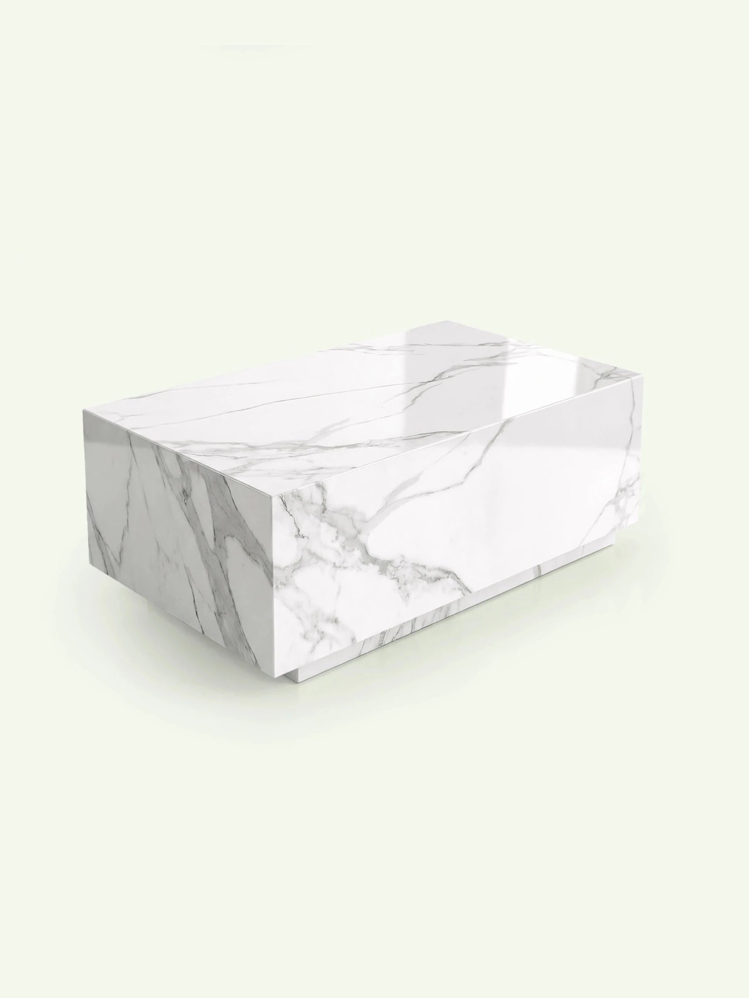 Perspektivische Ansicht des Madena Couchtischs in Calacatta White. Die 3D-Darstellung verdeutlicht die kubische, massive Form des Marmorblocks und den dezent eingerückten Sockel.